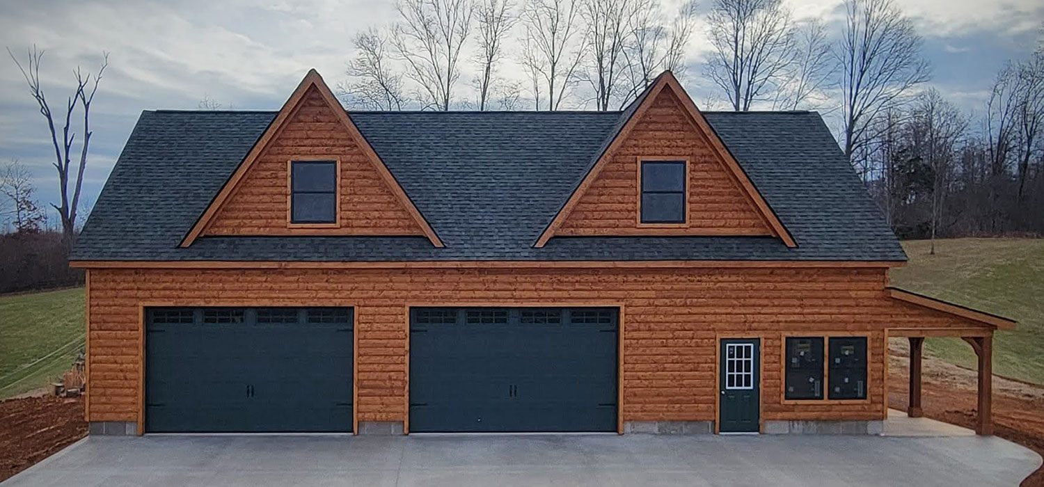 Log cabin garage with dormers
