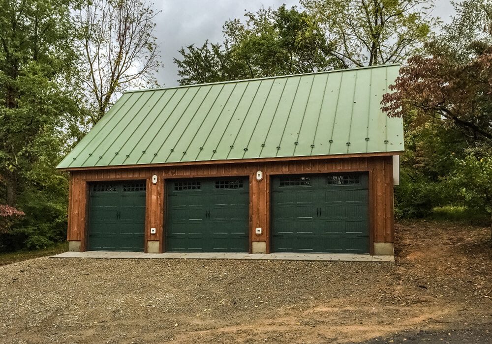 Single story with attic 24 x 36 2 story 3 car garage standing seam metal roof hardieplank siding board and batten front - Attic Garages by Custom Garages of Virginia